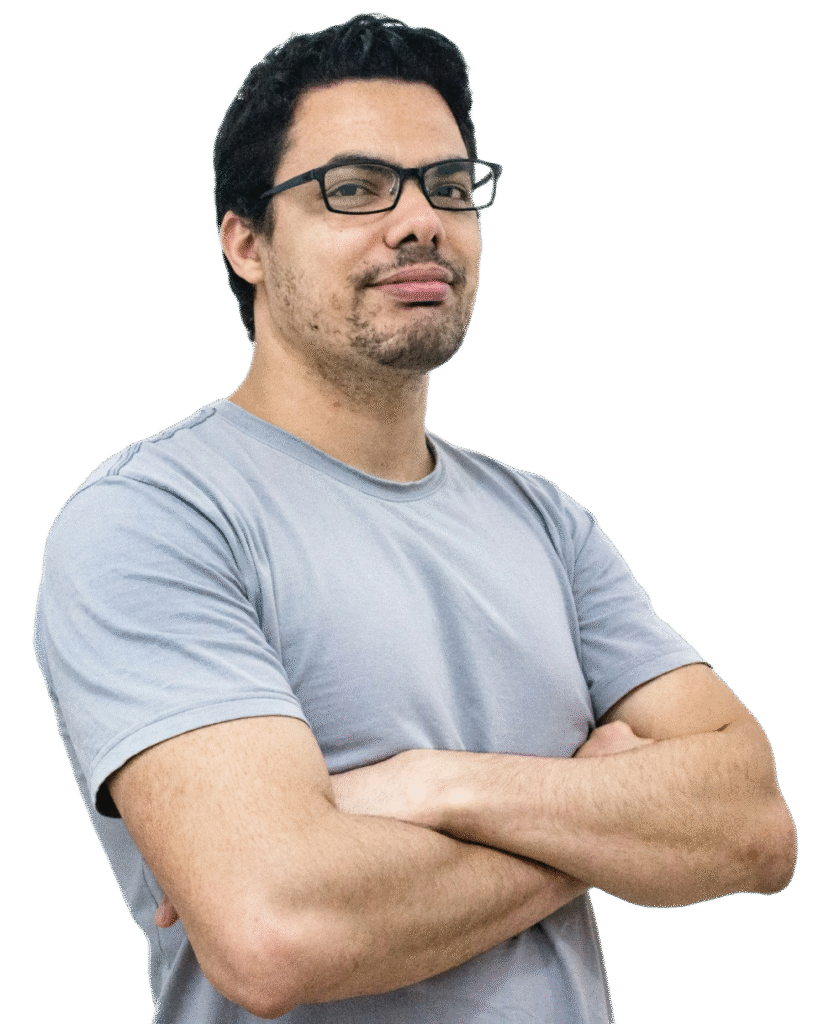 A man in a gray t-shirt and glasses